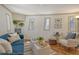 Cozy living room with plush blue sofa, unique architectural details, and stylish decor accents at 433 N Osprey Ave, Sarasota, FL 34236