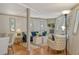 Inviting living room featuring hardwood floors, a blue sofa, stylish decor, and an abundance of natural light at 433 N Osprey Ave, Sarasota, FL 34236