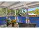 Inviting porch with blue privacy screen, comfortable seating, and outdoor view at 433 N Osprey Ave, Sarasota, FL 34236