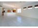 This dining room features neutral tile flooring and an open bar to the kitchen at 4341 Callista Ln, Sarasota, FL 34243