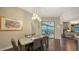 Dining room features an elegant table setting and view of the outdoor pool area at 4445 Oak View Dr, Sarasota, FL 34232