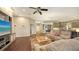 Open-concept living area with hardwood floors and seamless connection to the kitchen and dining spaces at 4445 Oak View Dr, Sarasota, FL 34232
