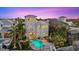 Exterior view of the house and backyard with a lovely pool, patio, and garden at 4607 5Th Ne Ave, Bradenton, FL 34208