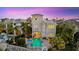 Aerial view of the home showcasing the beautiful pool, lush landscaping, and proximity to the water at 4607 5Th Ne Ave, Bradenton, FL 34208