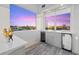Cozy bonus room with cabinets, beverage refrigerators, and a beautiful sunset view at 4607 5Th Ne Ave, Bradenton, FL 34208