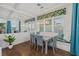 Charming dining room features hardwood floors, bright light, and a cozy dining nook for entertaining guests at 4607 5Th Ne Ave, Bradenton, FL 34208