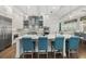 Beautiful kitchen with bar seating and pendant lighting, stainless steel appliances and an open floorplan at 4607 5Th Ne Ave, Bradenton, FL 34208