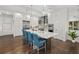 Spacious kitchen with large island and barstool seating, stainless steel appliances, and ample cabinet space at 4607 5Th Ne Ave, Bradenton, FL 34208