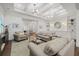 Bright living room features modern lighting, and built in shelving at 4607 5Th Ne Ave, Bradenton, FL 34208
