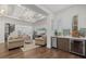 Living room features hardwood floors, an open floor plan, bar, and comfortable seating perfect for entertaining at 4607 5Th Ne Ave, Bradenton, FL 34208