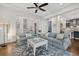 Cozy living room with access to kitchen and stairs; perfect for Gathering gatherings and relaxation at 4607 5Th Ne Ave, Bradenton, FL 34208