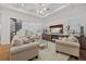 Bright living room features a spiral staircase, decorative lighting, and media center with beach scene on the TV at 4607 5Th Ne Ave, Bradenton, FL 34208