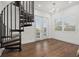 Bright living room features a spiral staircase and French doors to the outdoors at 4607 5Th Ne Ave, Bradenton, FL 34208