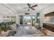 Open concept living room with pool views and stylish decor, flowing into the kitchen and dining area at 4607 5Th Ne Ave, Bradenton, FL 34208
