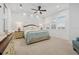 Bright main bedroom with tray ceilings, plantation shutters, and coastal decor at 4607 5Th Ne Ave, Bradenton, FL 34208