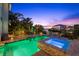 Backyard pool and spa area with lush landscaping and open-air dining area at 4607 5Th Ne Ave, Bradenton, FL 34208