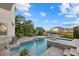 Relaxing pool and spa area offering a serene escape with well-manicured landscaping and a patio at 4607 5Th Ne Ave, Bradenton, FL 34208