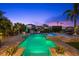 Backyard pool with an open-air dining area, spa, and beautiful landscaping at 4607 5Th Ne Ave, Bradenton, FL 34208