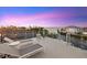 Rooftop deck with lounge chairs and a beautiful view of the water at sunset at 4607 5Th Ne Ave, Bradenton, FL 34208