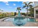Inviting pool area complete with a spa, patio seating, lush greenery, and a tranquil ambiance for relaxation at 4607 5Th Ne Ave, Bradenton, FL 34208