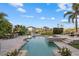 Resort-style pool area featuring a spa, sun loungers, outdoor dining, and beautifully landscaped surroundings at 4607 5Th Ne Ave, Bradenton, FL 34208