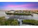 Scenic waterfront view showcasing luxury homes, boat docks, and lush landscaping, ideal for boating enthusiasts at 4607 5Th Ne Ave, Bradenton, FL 34208