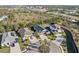 Aerial view of a home in a cul-de-sac with mature trees and lush landscaping at 4611 Los Robles Ct, Palmetto, FL 34221