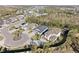 Aerial view of a home in a residential neighborhood featuring mature trees and sidewalks at 4611 Los Robles Ct, Palmetto, FL 34221