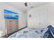 The bedroom has a ceiling fan, a dresser with a TV, and a closet at 4611 Los Robles Ct, Palmetto, FL 34221
