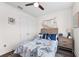 This bright, well-organized bedroom features a ceiling fan and nautical decor at 4611 Los Robles Ct, Palmetto, FL 34221