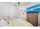 Charming bedroom boasts a dresser with a TV, closet, and tasteful decor creating a cozy and relaxing space at 4611 Los Robles Ct, Palmetto, FL 34221