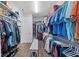 The walk-in closet offers built-in storage shelves and racks for organization and easy access at 4611 Los Robles Ct, Palmetto, FL 34221