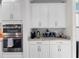 Kitchen cabinets with sleek countertops, stainless steel appliances, and stylish backsplash at 4611 Los Robles Ct, Palmetto, FL 34221