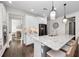 Open kitchen featuring a large island with granite countertops and modern stainless steel appliances at 4611 Los Robles Ct, Palmetto, FL 34221