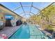 Inviting outdoor living space featuring a screened-in pool, comfortable seating, and an outdoor TV at 4611 Los Robles Ct, Palmetto, FL 34221