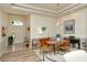 Formal dining area with stylish lighting, piano, and modern furnishings at 4629 Samoset Dr, Sarasota, FL 34241