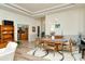 Dining room with wood table, stylish lighting, and view to hall and office at 4629 Samoset Dr, Sarasota, FL 34241
