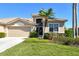 Inviting exterior with a well-kept lawn, mature landscaping, and a clean, modern facade at 4629 Samoset Dr, Sarasota, FL 34241