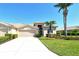 Charming single-story home with a two-car garage, lush landscaping, and a well-manicured lawn at 4629 Samoset Dr, Sarasota, FL 34241