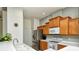 Bright kitchen with stainless steel appliances, white countertops, and ample cabinet space at 4629 Samoset Dr, Sarasota, FL 34241
