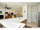 Modern kitchen with breakfast bar overlooking the living area, featuring stainless steel appliances at 4629 Samoset Dr, Sarasota, FL 34241