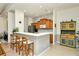 Kitchen featuring breakfast bar, wooden cabinets, and stainless steel appliances at 4629 Samoset Dr, Sarasota, FL 34241
