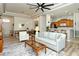 Open-concept living room with modern furniture and a view into the kitchen and dining area at 4629 Samoset Dr, Sarasota, FL 34241