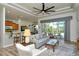 Cozy living space featuring a comfortable sofa, a sliding glass door, and neutral decor, creating a warm and inviting atmosphere at 4629 Samoset Dr, Sarasota, FL 34241