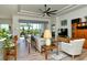 Inviting living area with a ceiling fan, plenty of natural light, and stylish furniture, perfect for relaxation and entertaining at 4629 Samoset Dr, Sarasota, FL 34241