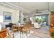 Open-concept living and dining area featuring stylish furniture, a ceiling fan, and an abundance of natural light at 4629 Samoset Dr, Sarasota, FL 34241