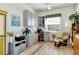 Well-lit office space with hardwood floors, organized storage, and comfortable seating at 4629 Samoset Dr, Sarasota, FL 34241