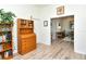 Bright office space featuring a wood roll-top desk, bookshelf and wood flooring at 4629 Samoset Dr, Sarasota, FL 34241