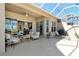 Outdoor living on this screened patio complete with lounge, grill, and seating area at 4629 Samoset Dr, Sarasota, FL 34241