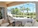 Relaxing screened-in patio with comfortable seating overlooking the lush greenery at 4629 Samoset Dr, Sarasota, FL 34241